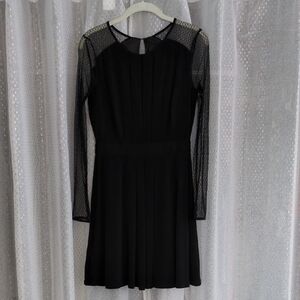 BCBGeneration Black Dress With Fishnet Sheer Sleeves Knee Length